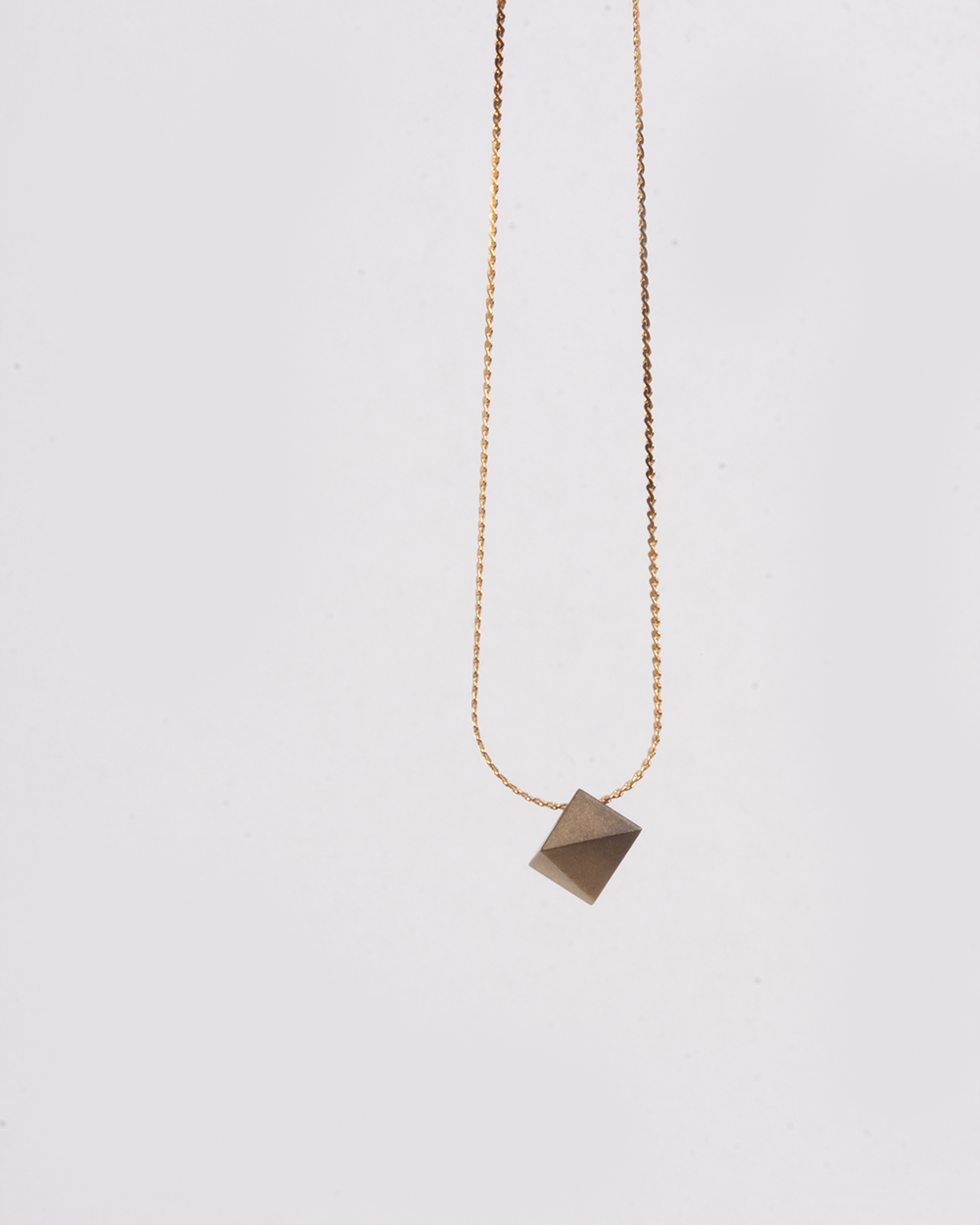 Brass rhombo necklace.